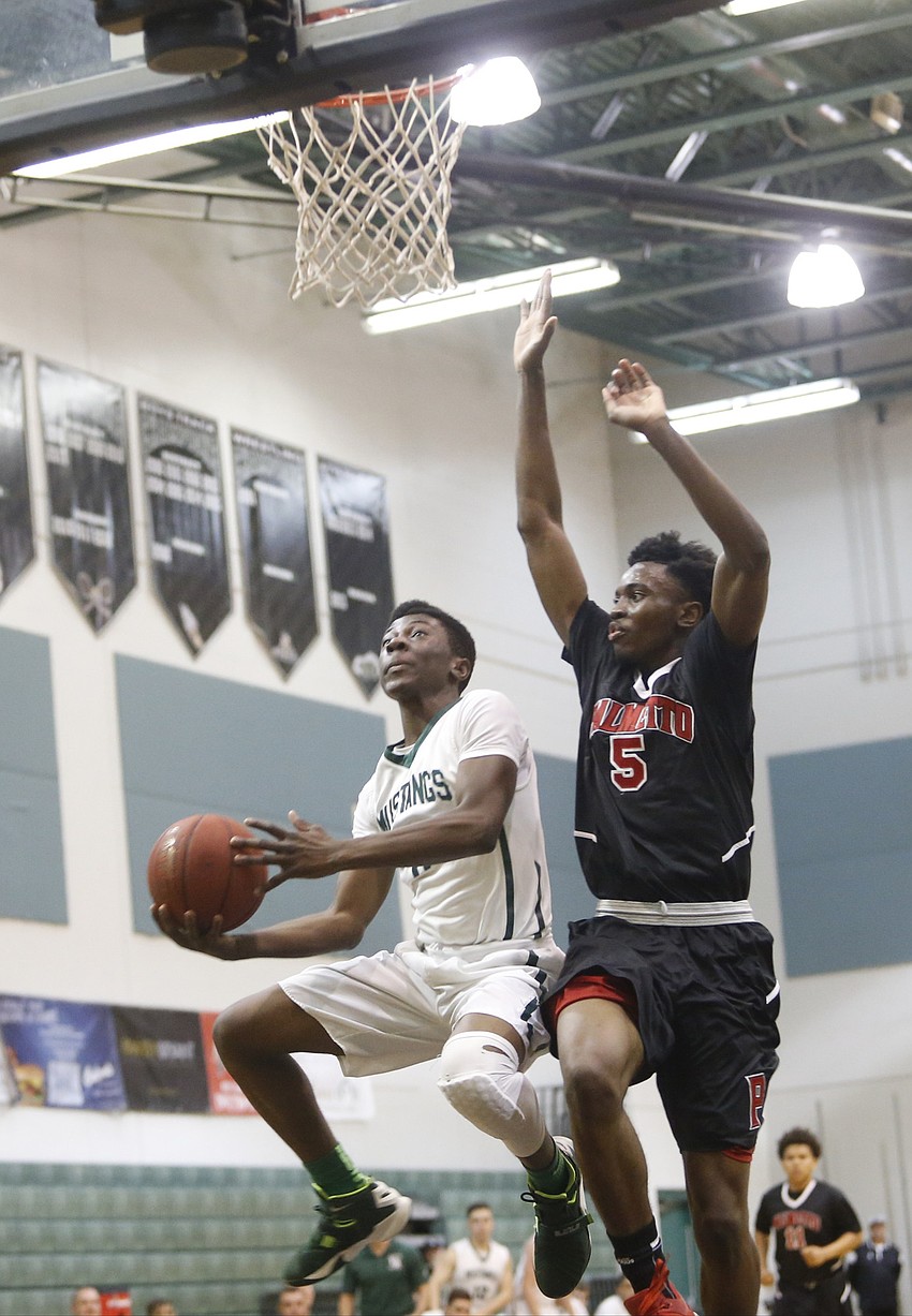 Lakewood Ranch junior guard Blauvelt Georges goes up for a shot during the Class 7A-District 11 championship Feb. 5.