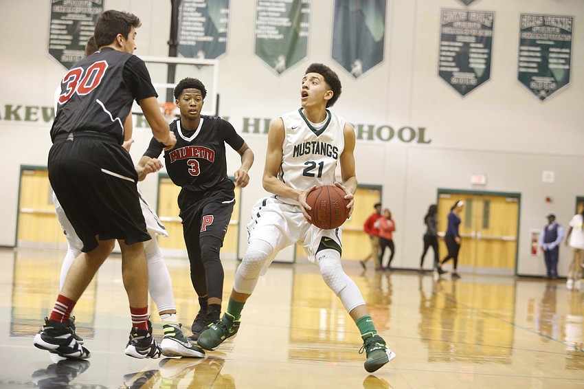 Lakewood Ranch sophomore guard Evan Spiller looks for an open teammate in the first half.