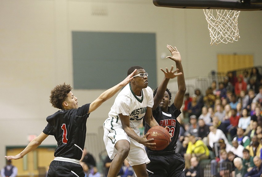 Lakewood Ranch sophomore guard Harry Barthelemy drives to the hoop in the first half.