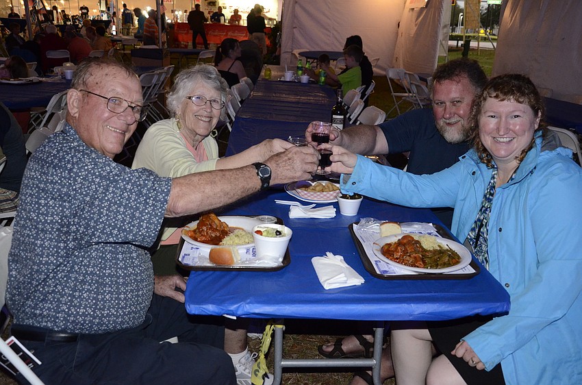 Norman and Janet Reetz of Ellenton and Lori and Chris Reetz of Alaska start their meal off with a toast.