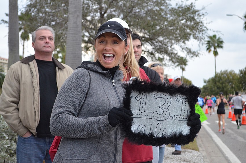 Diane Strutt cheers on runners as the approach mile six.