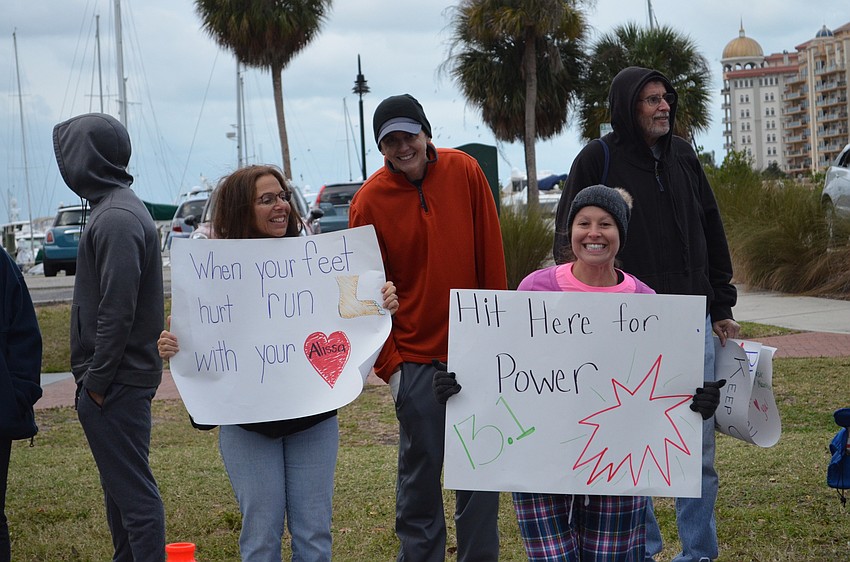 Marcia Lichtenstein and Genna Custard made signs to cheer on Alissa Himelfarb.