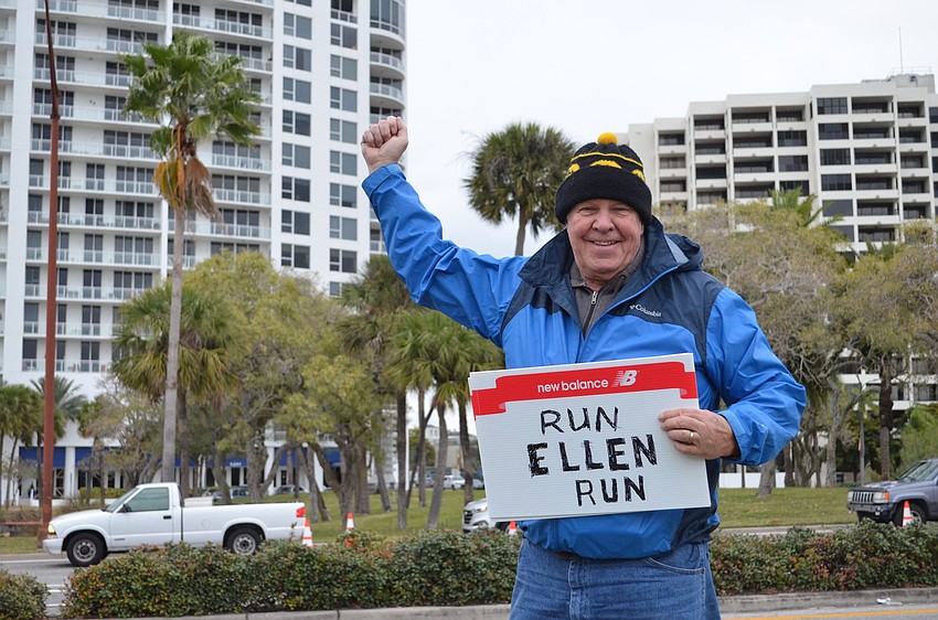 Mike Langer waits for his wife Ellen to run by him.