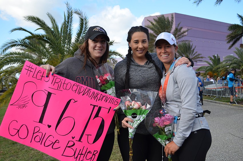 Ro Marchese with Hillary Butler cheered on Paige Butler who was running in memory of her mother Sharon Butler.