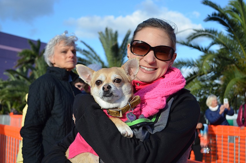 Vanessa Casciola and Presley wait at the finish line to cheer on remaining runners.