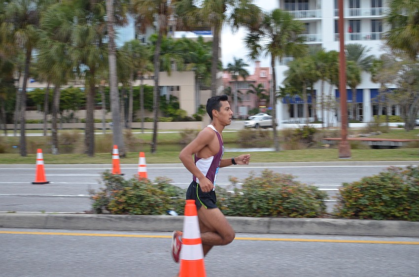 Warren Grajalez took the lead early and managed to win overall for the 2016 Sarasota Music Half Marathon.