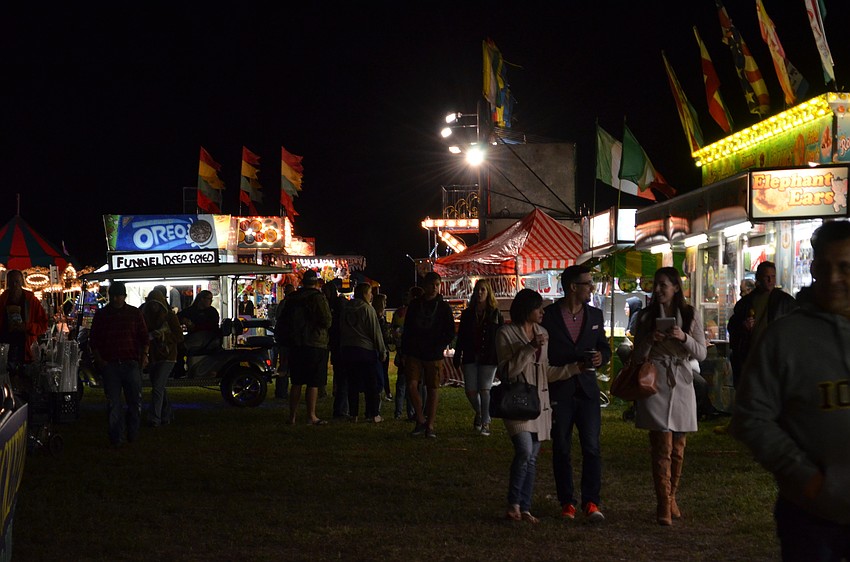 Families enjoyed a night with carnival rides and games at the Sarasota Mardi Gras Music & Food Festival.