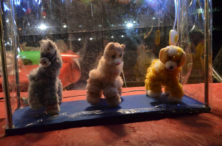 Vendors sold festive puppets at the Sarasota Mardi Gras Music & Food Festival.