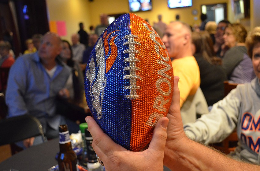Carol and Bob Veazie brought their own football covered in Swarovski crystals.
