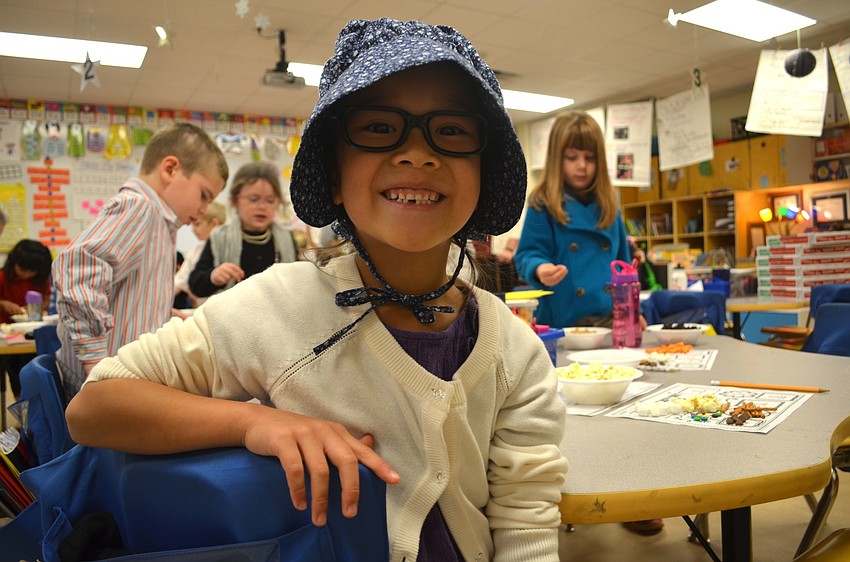 Sophia Greenleaf loves playing dress up and wearing a bonnet and glasses.