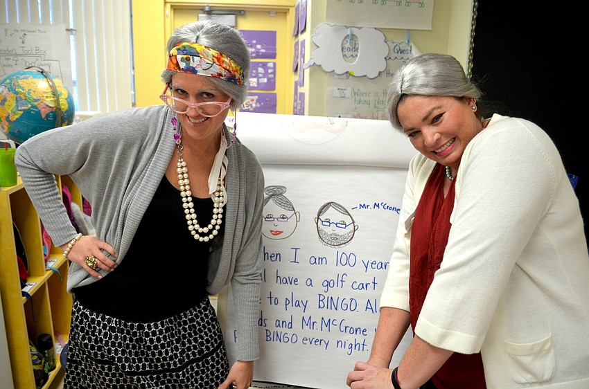 Kindergarten teacher Cristina McCrone and intern Jessica Bolduck show off their 100-year-old versions of themselves.
