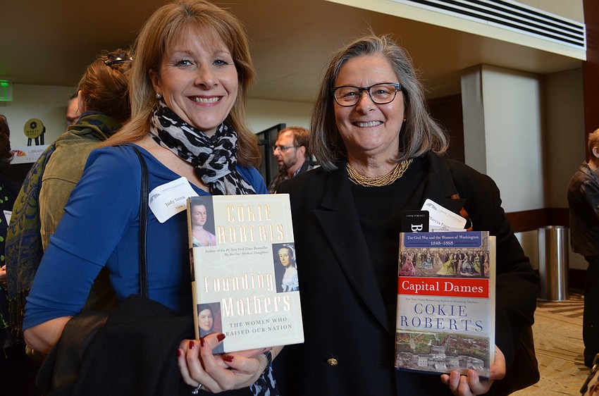 Judy Szinka with a copy of Cokie Roberts' book 
