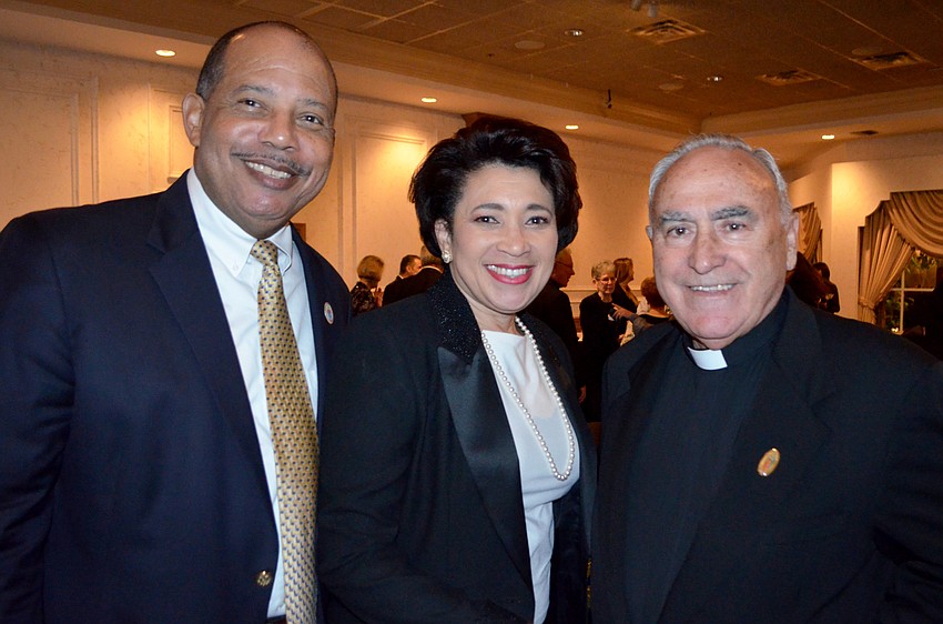 Roland and Sabrina Gibson with Fr. Celestino