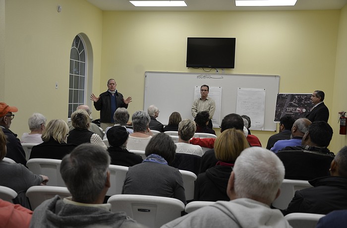 Sarasota County planner Jack Wilhelm, agent Joel Freedman of Freedman Consulting Group, and Hytham Bakr, board member, answer questions from the audience.