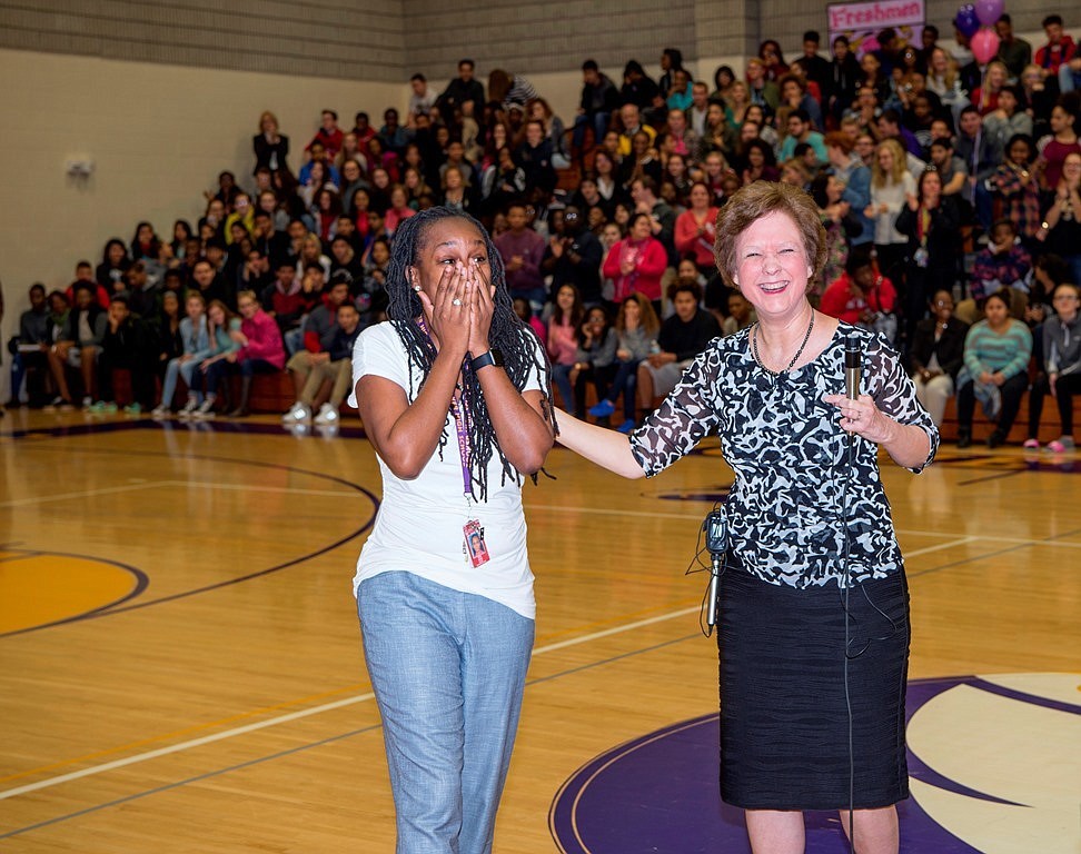 Photo by Cliff Roles, courtesy Education Foundation of Sarasota County. Khea Davis in shock while Superintendent Lori White explains that she's a finalist for Teacher of the Year.