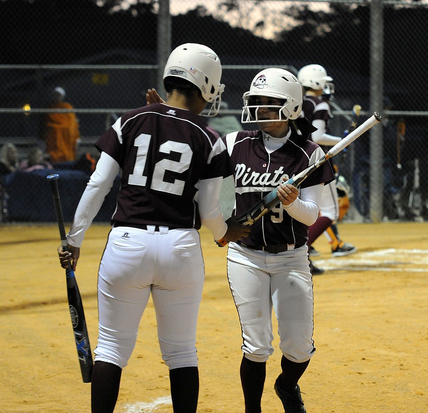 Braden River's Zaire Yancy congratulates Myah Moy in the first inning.