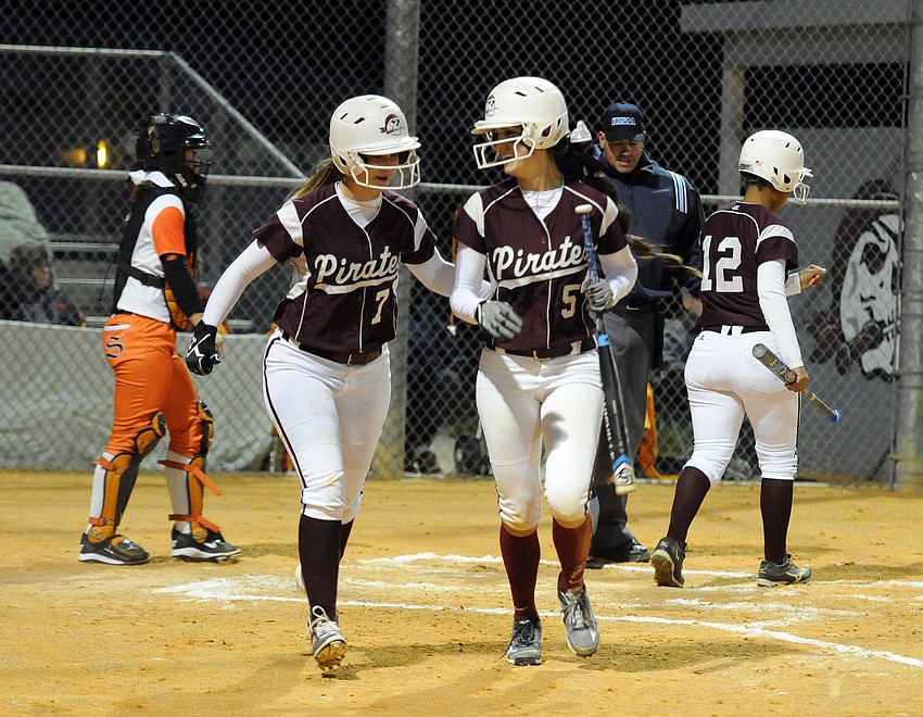 Braden River's Bethaney Keen and Sarah Crawford celebrate after scoring a pair of runs in the first inning.