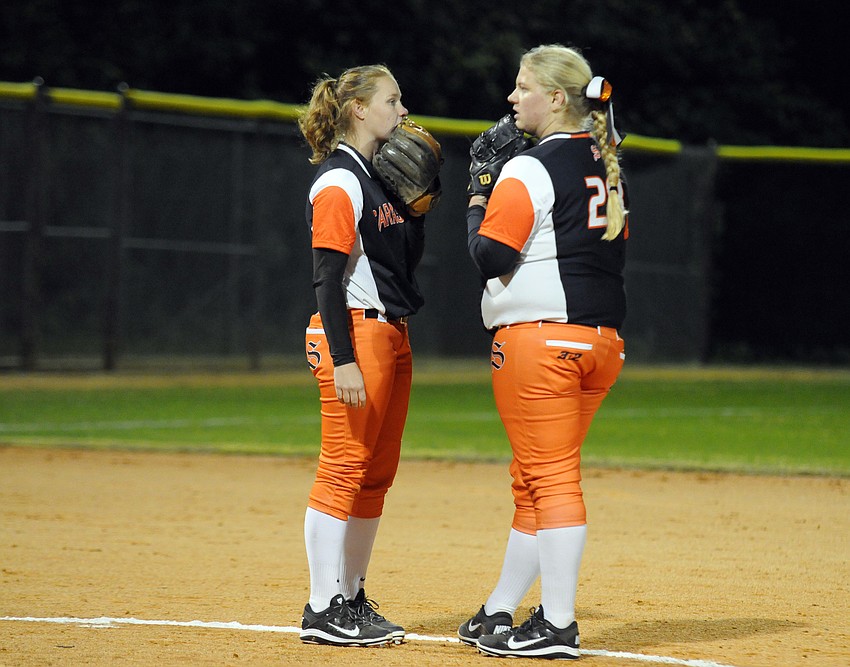 Sarasota third baseman SarahBeth Wengerd talks with pitcher Brittany Bendel in the first inning.