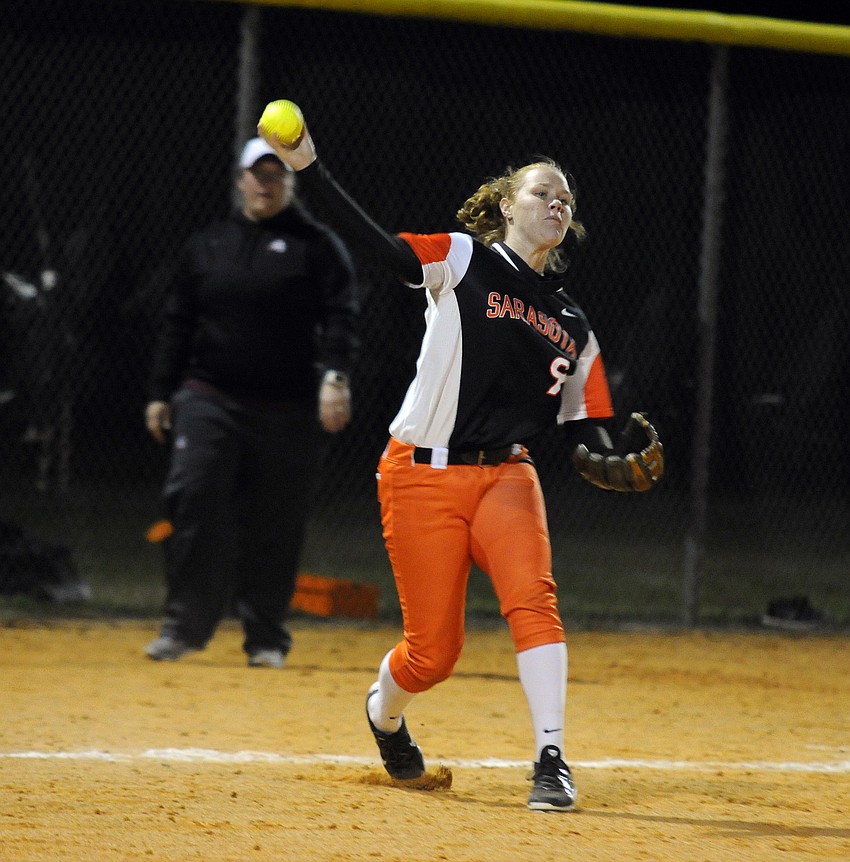 Sarasota senior third baseman SarahBeth Wengerd throws the ball back to first base for an out.