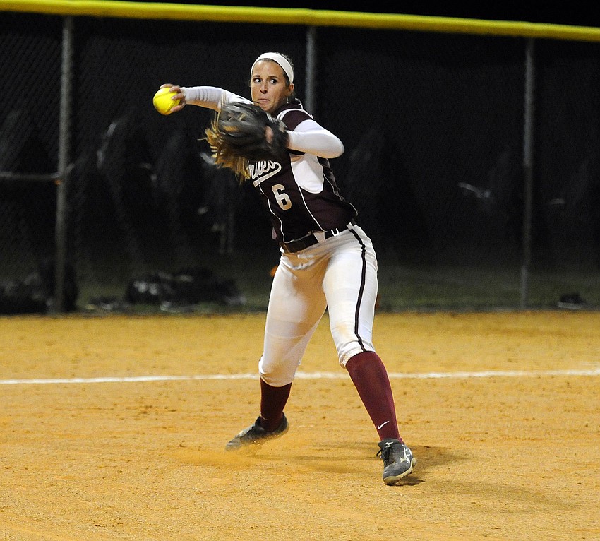 Braden River third baseman Casey Farrow throws the ball back to first base in the fourth inning.