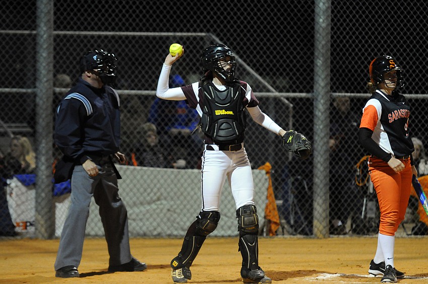 Braden River senior catcher Kylie Toler tosses the ball back to the mound in the fourth inning.