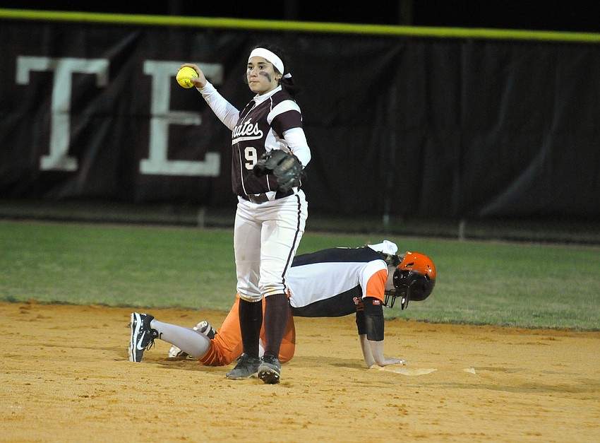 Braden River junior Myah Moy holds Sarasota's Victoria Martin at second base.
