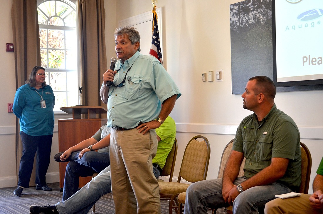 Tom Burish, executive director of Florida Landscape Management Association, educates residents about landscape best practices.
