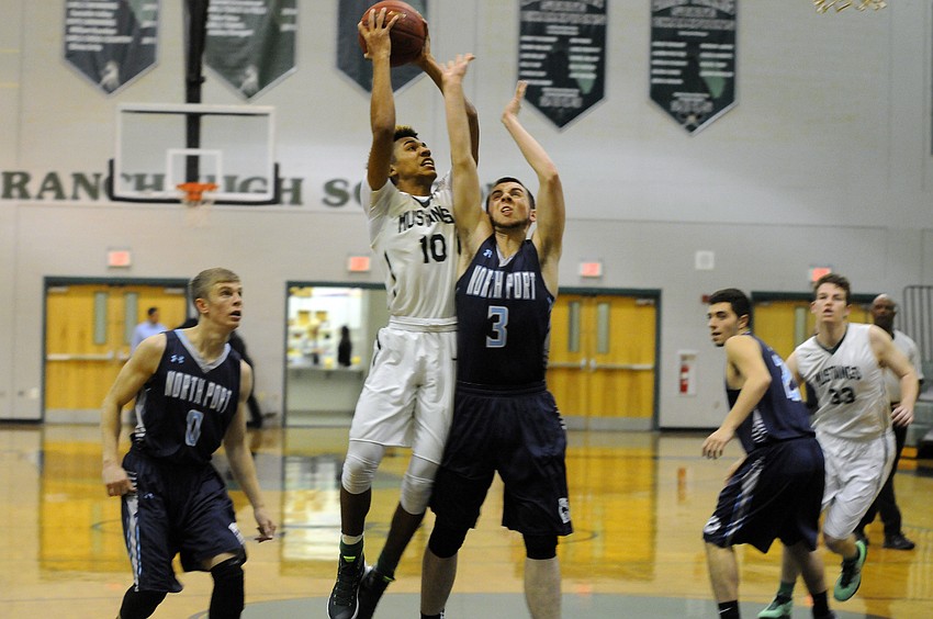 Lakewood Ranch sophomore guard Damien Gordon muscles his way to the hoop in the first quarter.