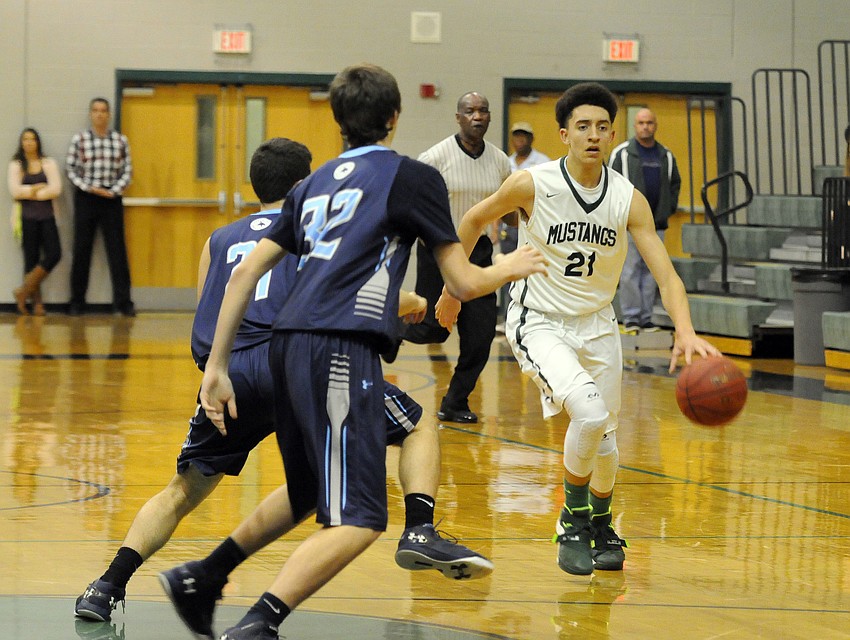 Lakewood Ranch's Evan Spiller brings the ball down the court in the first half.