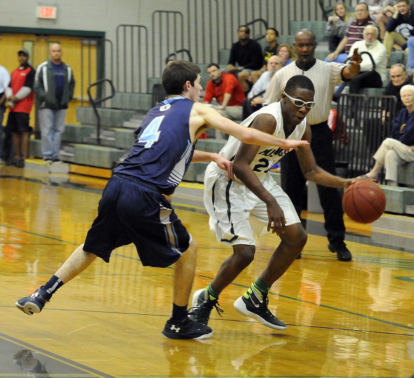 Lakewood Ranch's Harry Barthelemy attempts to dribble the ball past a North Port defender.