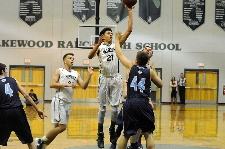 Lakewood Ranch sophomore guard Evan Spiller attempts a shot in the second quarter of the Mustangs 74-61 victory versus North Port in the Class 7A-Region 3 quarterfinals Feb. 11.
