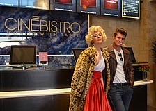 Marilyn Monroe and James Dean, Olivia Gibson Dylan Maggio respectively, welcome guests to the CineBistro VIP Grand Opening.
