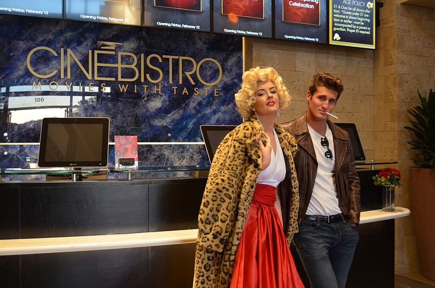 Marilyn Monroe and James Dean, Olivia Gibson Dylan Maggio respectively, welcome guests to the CineBistro VIP Grand Opening.