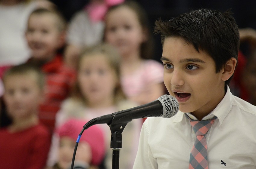 Adam Elshimy talks during the first-grade performance.
