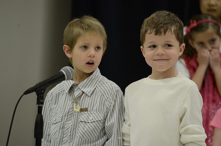Hunter Ganey and Brice Wilson ask another first-grader to be their Valentine.