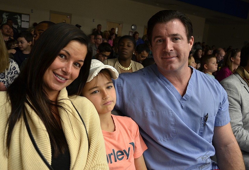 Marcie, Chase and Bart Monet wait for their son and brother, Hudson, to perform.