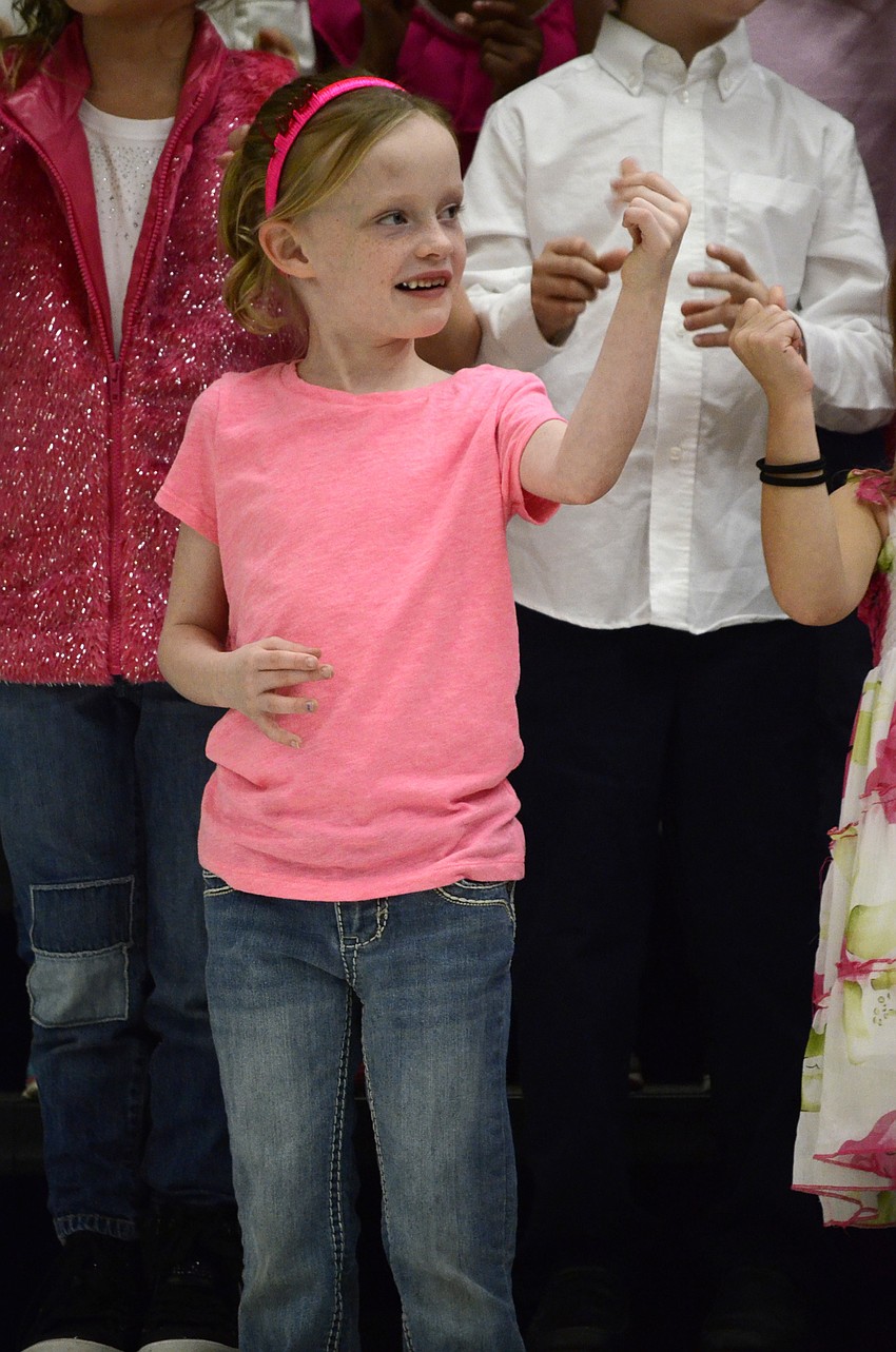 Sydney Cramer snaps her fingers for a song.