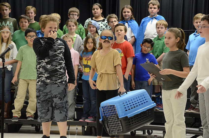 Patrick Willin, Kara Crawford, Makayla Mocadlo and Jimmy Dowling perform a skit about hunting endangered animals.