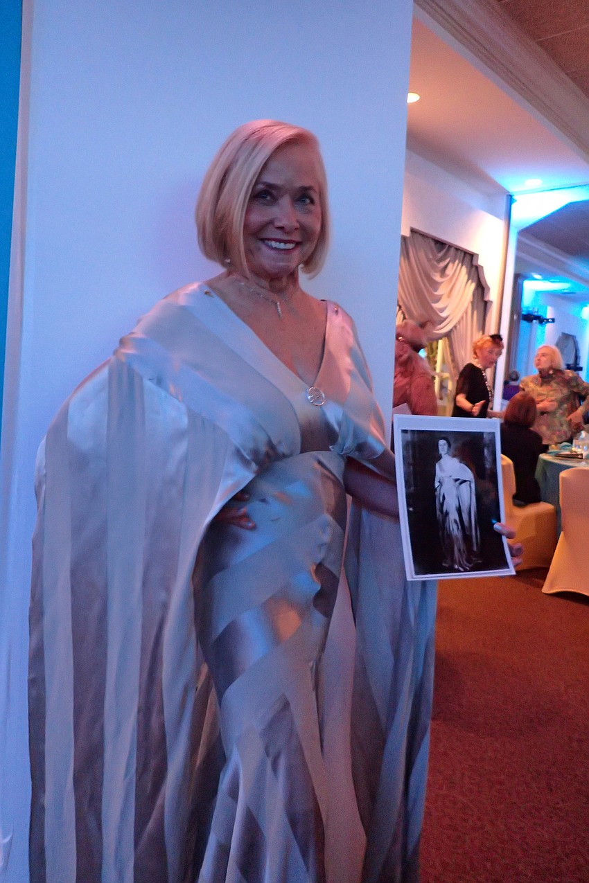 Hope Byrnes, with a photo of her mother, Irma Kapella, wearing the same dress in her youth