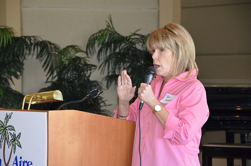 Patti Hernandez goes over a few business items before the members eat lunch.