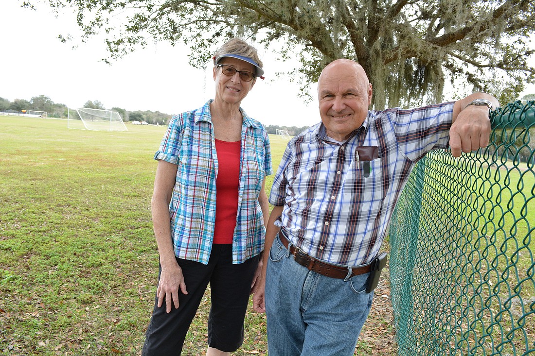 Lakewood Ranch Garden Club co-vice president Lori Walker and CDD 4 Supervisor Joe Sidiski are eager to see the garden be cultivated. It will share part of the fence with the Lakewood Ranch Dog Park.