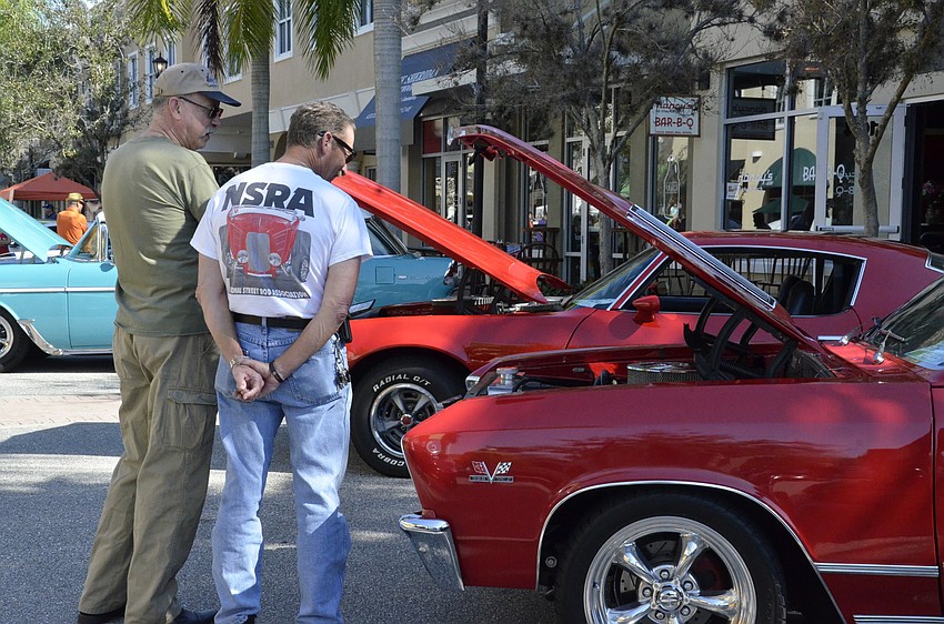 Bill Prater and John Lee of Rosedale check out a 1967 Chevy Chevelle.