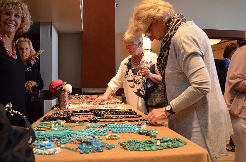 Patricia Hope browses jewelry before the show.