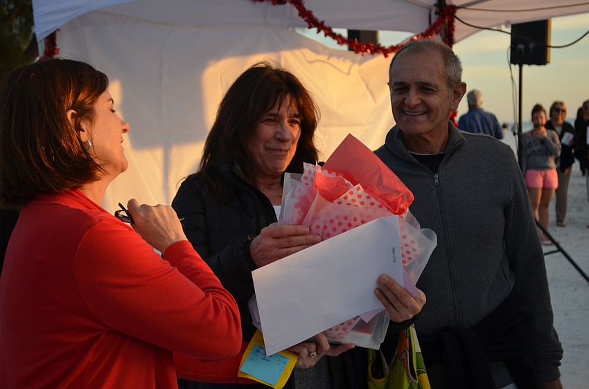 Sam and Chris Valeo are presented with a gift for being the couple in attendance married the shortest amount of time. They are still newlyweds celebrating their two month anniversary.