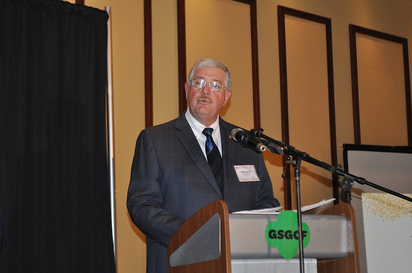 Richard Cyphers leads the invocation.