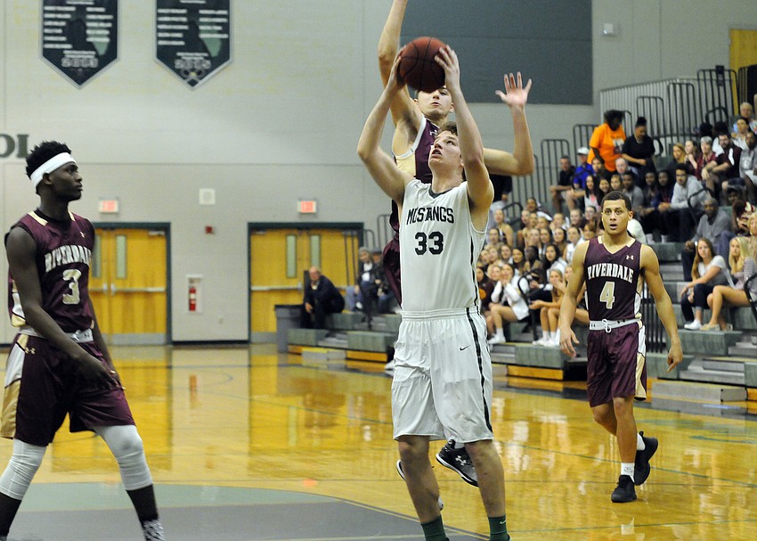 Forward Justin Muscara puts up a shot in the first quarter.