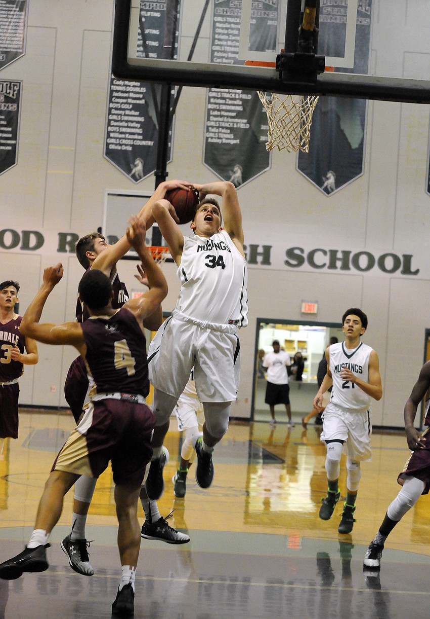 Lakewood Ranch sophomore forward Jack Kelley drives to the hoop in the first quarter.