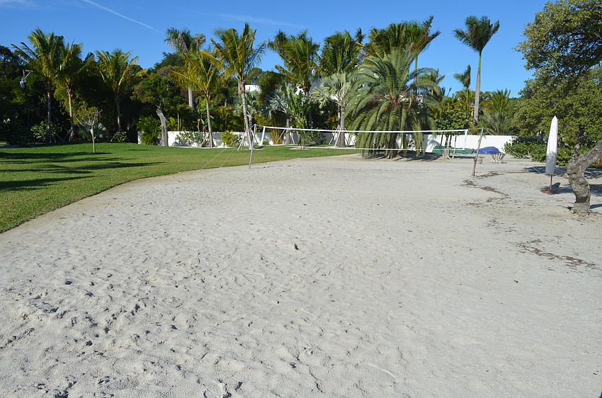The 1.65-acre backyard includes a sand volleyball court.