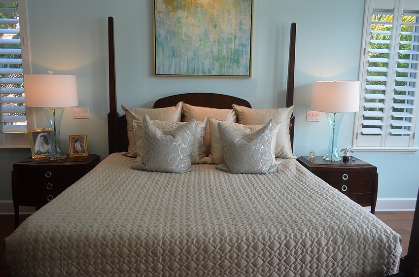 The master bedroom predominately features the color blue, a trend throughout the house.