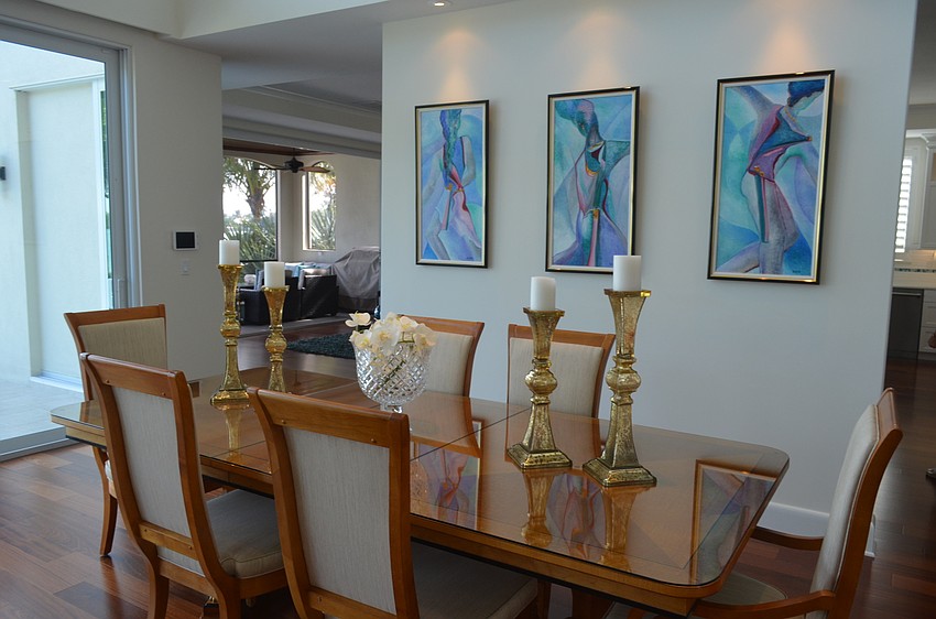 A spacious room in the center of the house features a living and dining area.